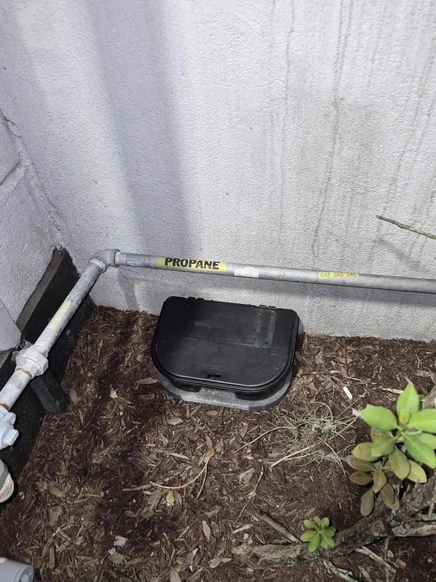AlphaPro bait station installed outside a home